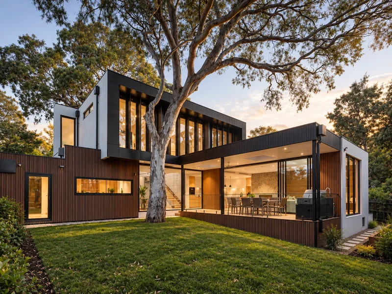 Contemporary exterior with dark timber, white walls and broad glazing